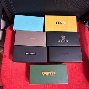 Seven designer boxes for glasses cases, empty